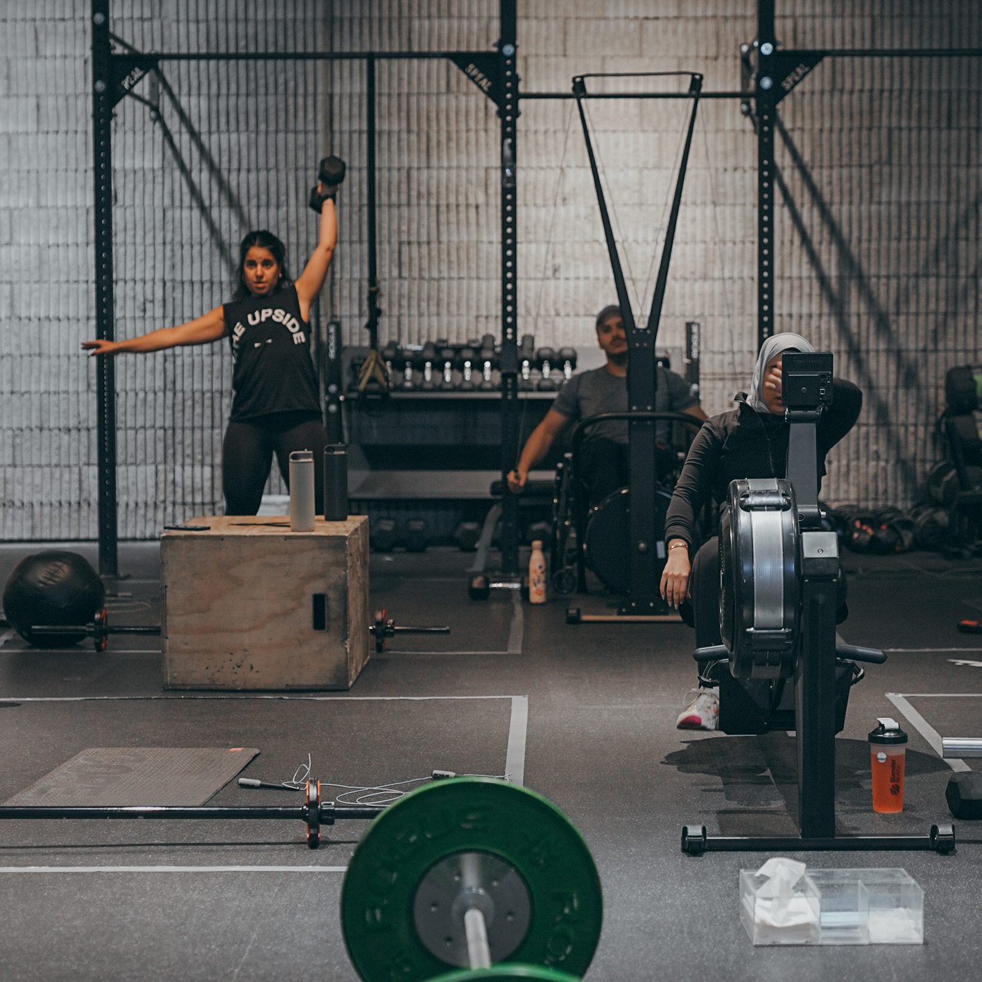 Intense group training session with multiple athletes working out together