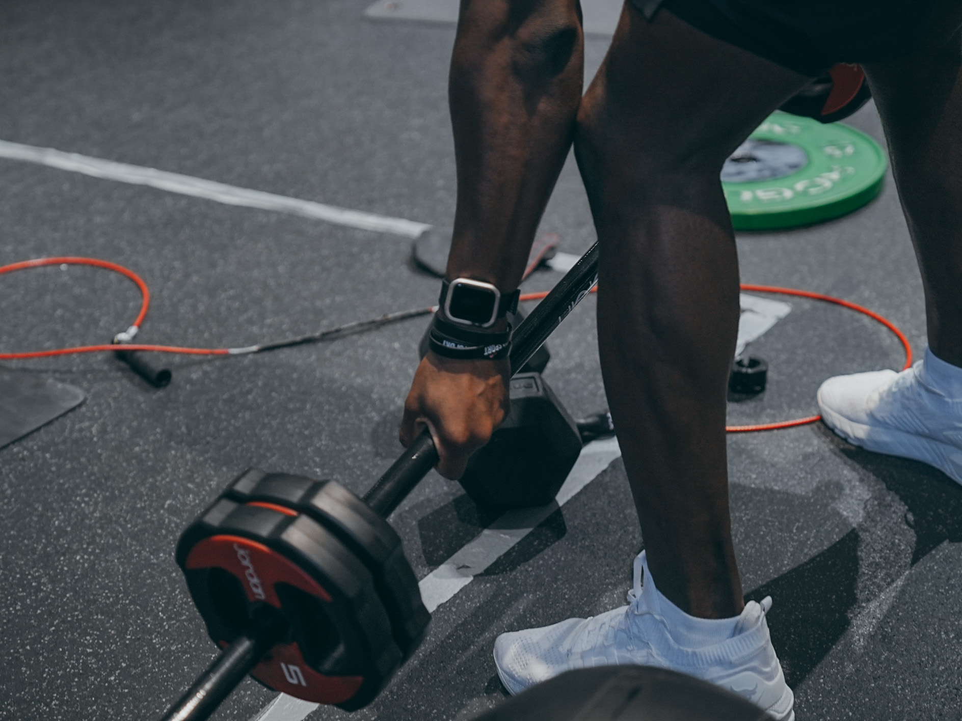 Athlete pushing weighted sled during high-intensity training session